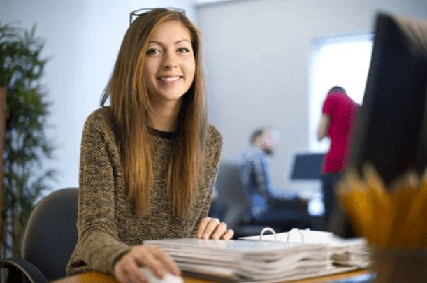 Single Girl sitting at the desk in the office working ZumaZip